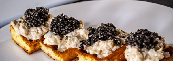 Waffles with crab meat and caviar