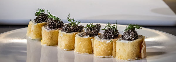 Pancake roll with smoked salmon and caviar