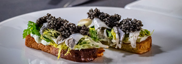 Toasted brioche with marinated anchovies and caviar